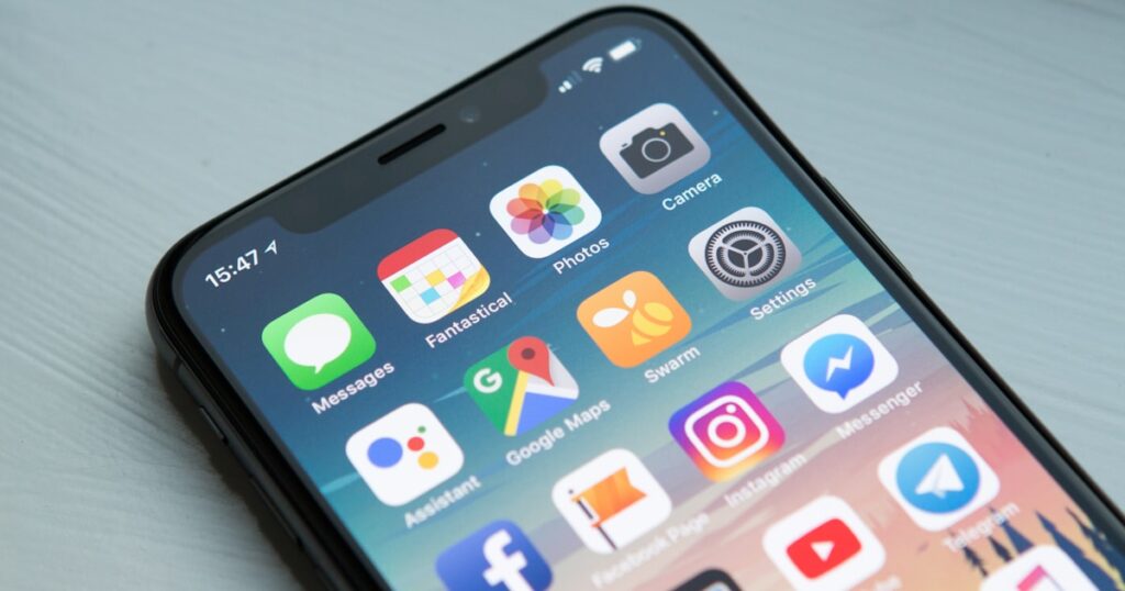 kotlin multiplatform transforming mobile - Mobile app development with smartphone showing application interface