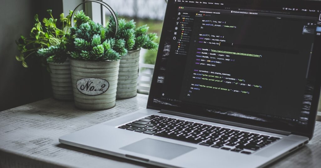 mobile app testing automation - Web development workspace with responsive design on multiple screens